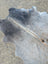 Sun1 large lovely cowhide rug in gray with natural fur texture and subtle brownish undertones showing unique characteristics