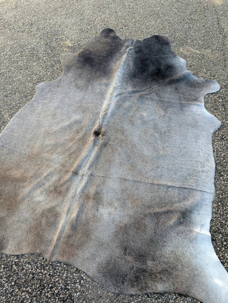 Large cowhide lovely cowhide rug in natural gray and black with soft textured surface and unique characteristics