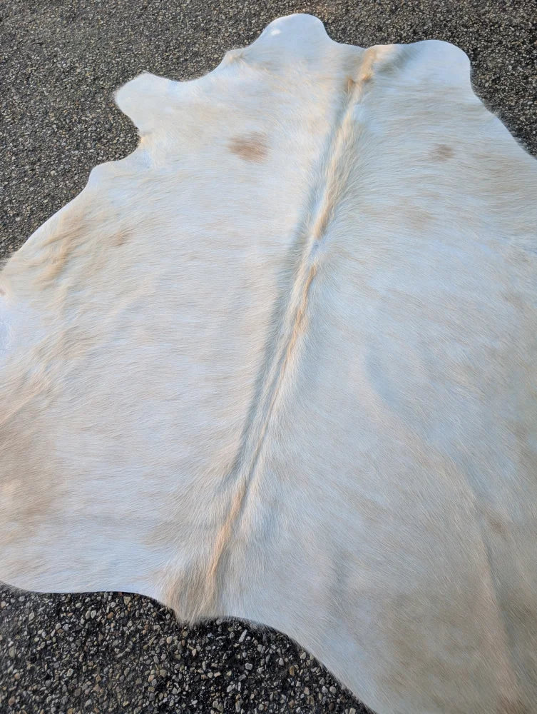 Sun10 71.5 x 67 large cowhide lovely cowhide rug with natural white color and subtle tan beige markings along spine