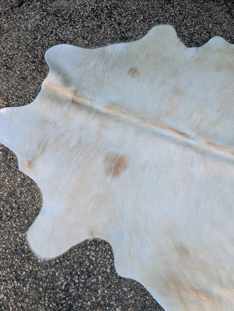 Sun10 large cowhide lovely cowhide rug with natural brown spots and a soft textured surface 71.5 by 67 inches