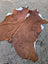 Sun11 80 x 66 large cowhide rug with natural brown and white fur texture showing unique characteristics