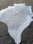 Large lovely grey cowhide rug with natural texture and unique characteristics measuring 78 by 70 inches