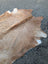 Tan and white large cowhide rug with natural textured surface and unique characteristics lovely cowhide rug sun16