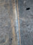 Gray faux fur large cowhide rug with central seam and subtle brownish highlights lovely cowhide rug unique characteristics