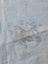 Large lovely cowhide rug with light blue and beige soft fur showcasing unique characteristics and texture