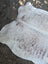 Large lovely cowhide rug in white and brown speckled natural fur texture with unique characteristics 84 x 66 inches