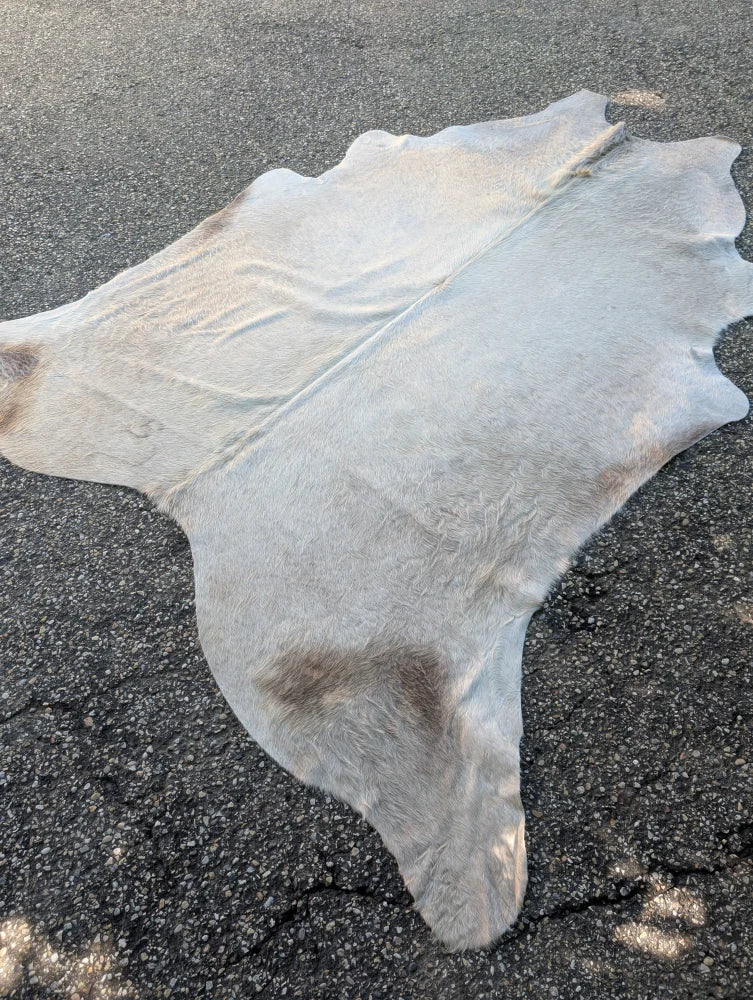 Sun9 83 x 74 large cowhide lovely cowhide rug with natural white and subtle brown patches featuring unique characteristics