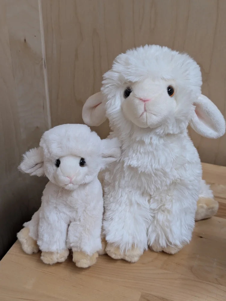Super soft lambs plush lamb toy with soft white fluffy texture and black button eyes perfect for cuddling