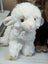 A super soft plush white lamb toy with fluffy fur and small black eyes perfect for cuddling and gifts