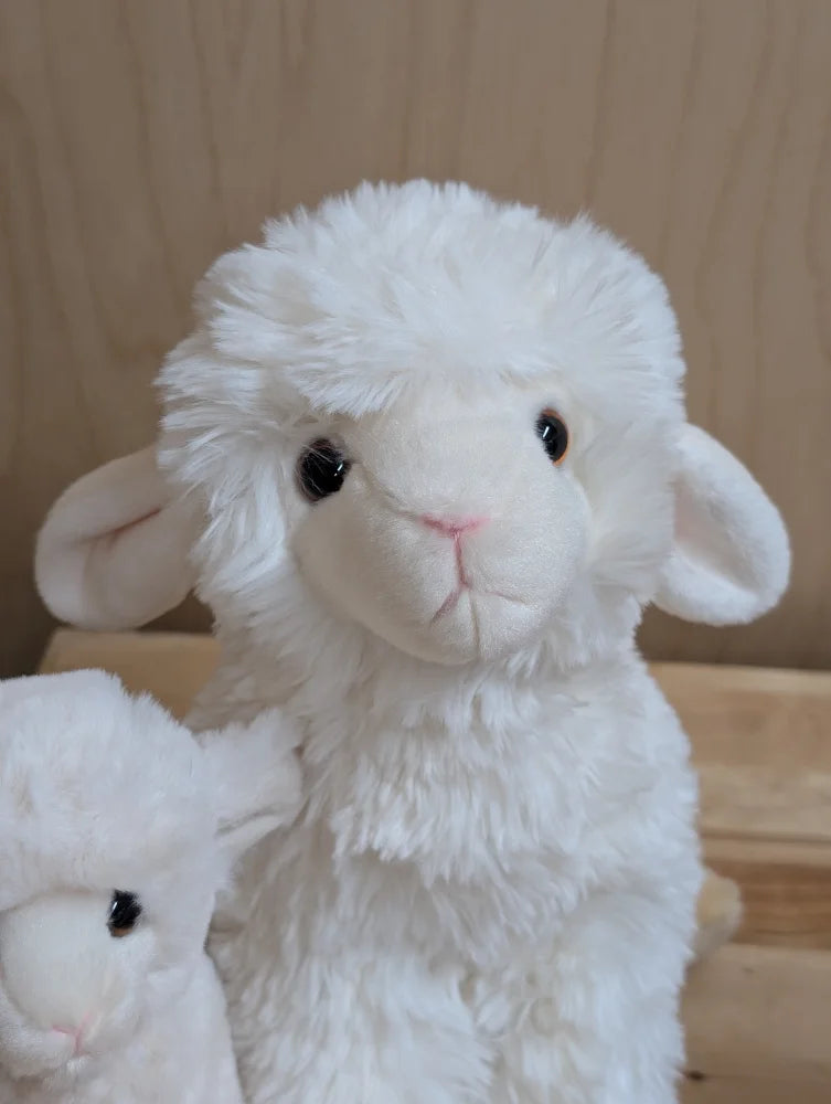 A plush white lamb toy from super soft lambs with fluffy fur and black button eyes perfect for cuddling