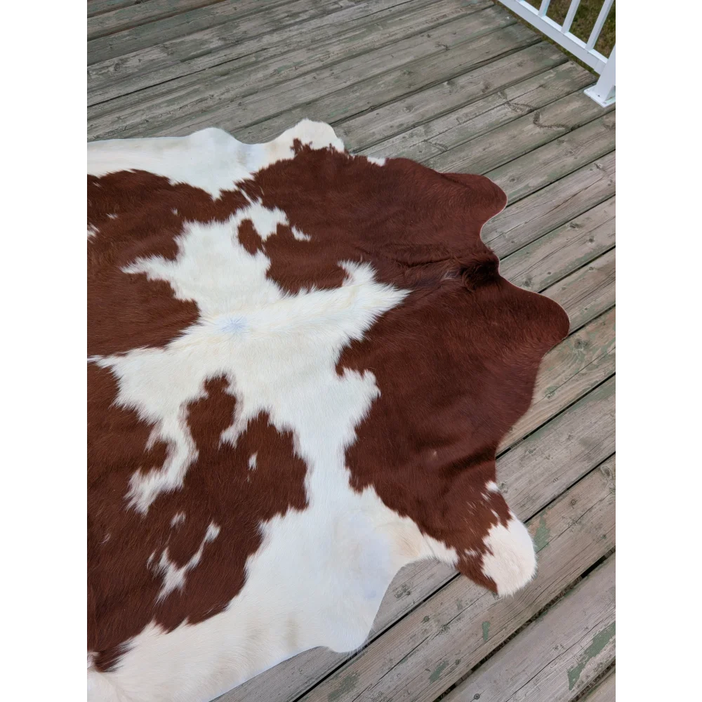 Brown and white 75 x 69 inch large cowhide rug with natural fur texture and unique characteristics
