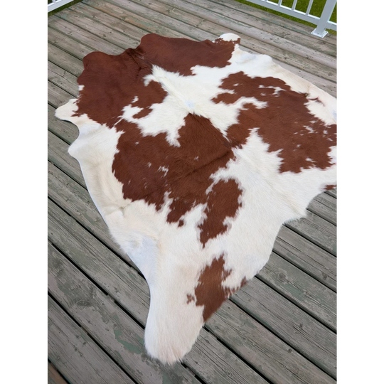 T11 75 x 69 large cowhide rug with brown and white natural fur texture and unique characteristics