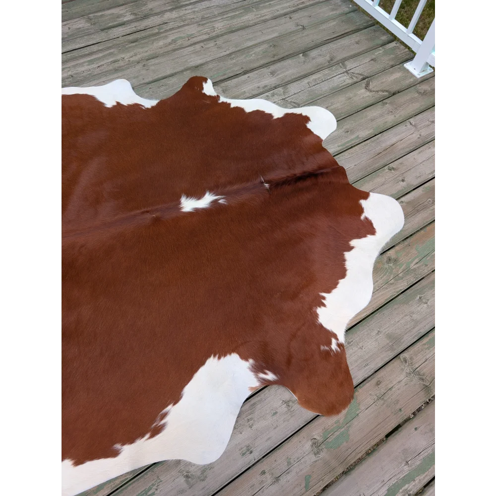 Large cowhide rug t13 80 x 68 with brown and white natural irregular edges showcasing unique characteristics