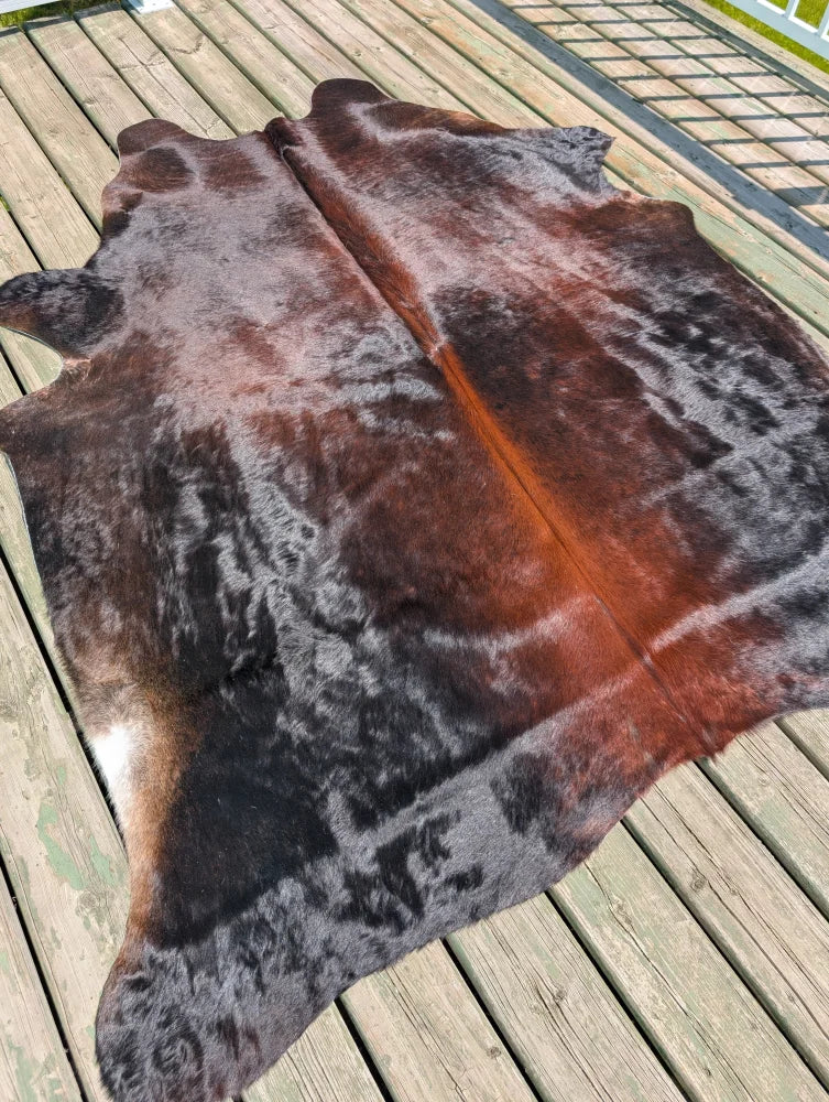 Large cowhide angus oliver rug in natural brown and black with soft textured surface perfect for any space