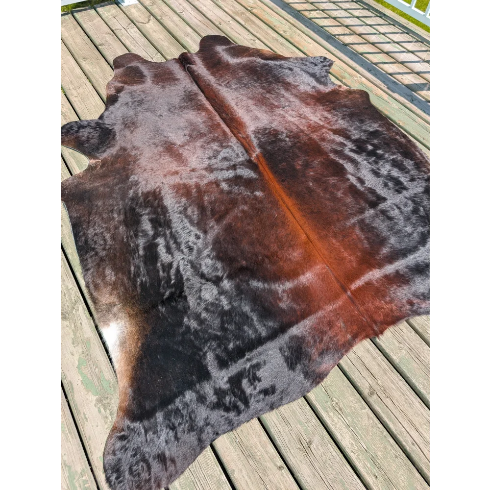 Large cowhide angus oliver rug in natural brown and black with soft textured surface perfect for any space
