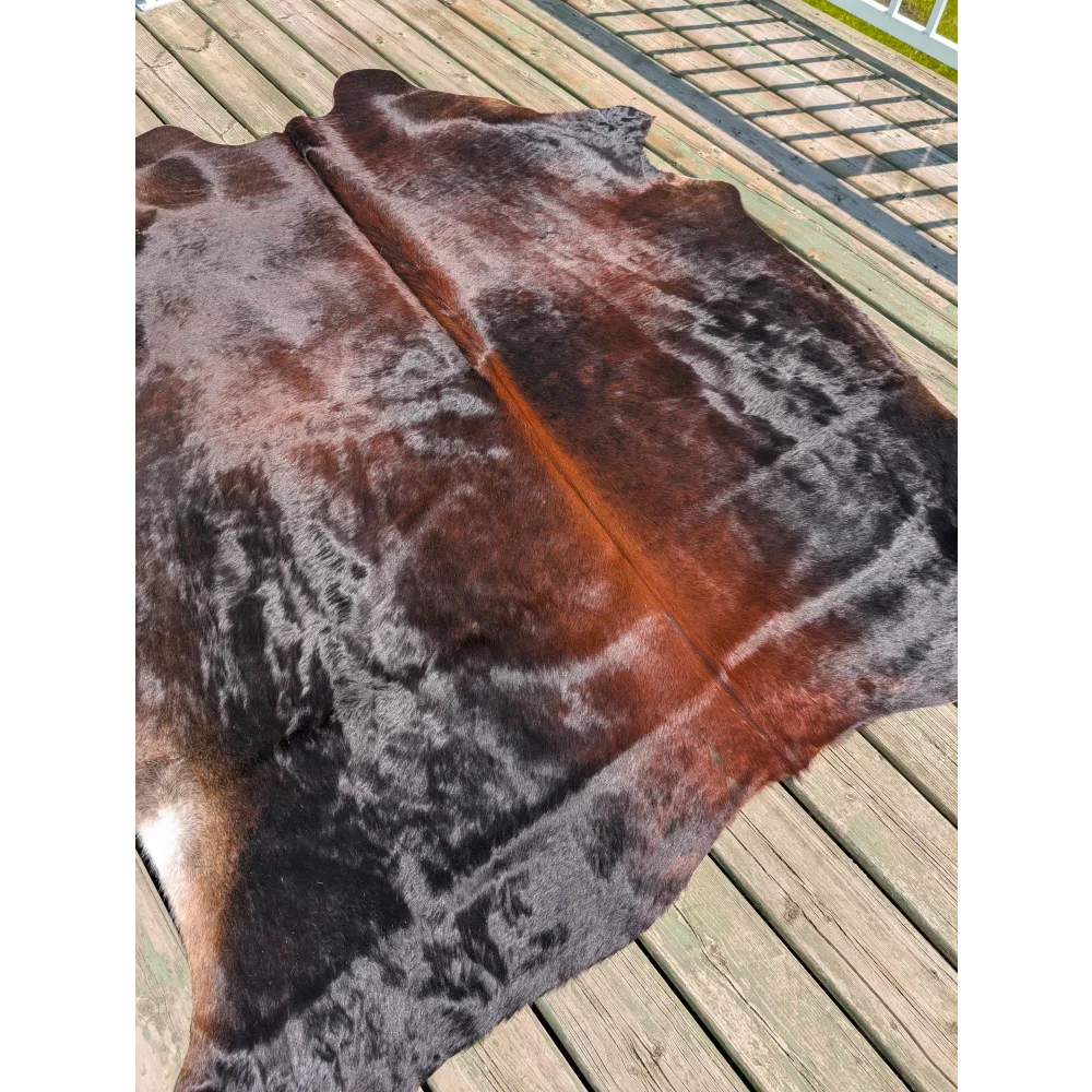 Large cowhide rug t16 78 x 64 with dark brown to reddish brown gradient and black patches by angus oliver
