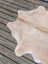 T18 77 x 63 beautiful large cowhide rug in natural tan with soft texture and subtle white patches by angus oliver
