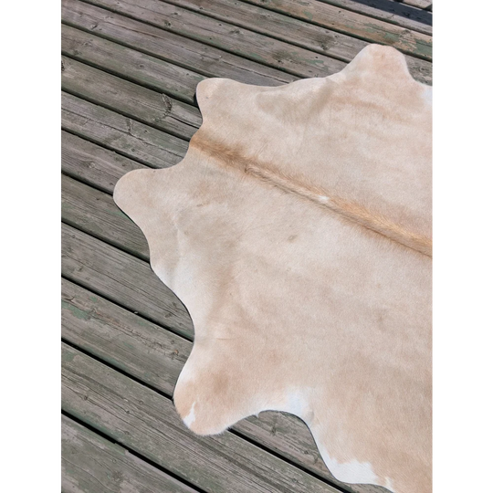 T18 77 x 63 beautiful large cowhide rug in natural tan with soft texture and subtle white patches by angus oliver