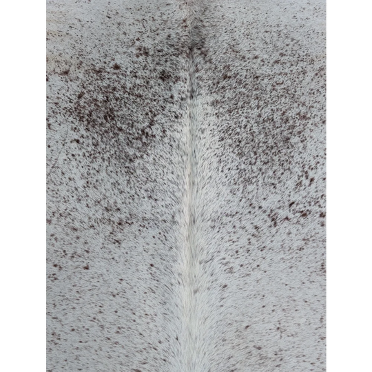 Large gray and white speckled cowhide rug with unique characteristics and natural fur texture in 73 x 63 size