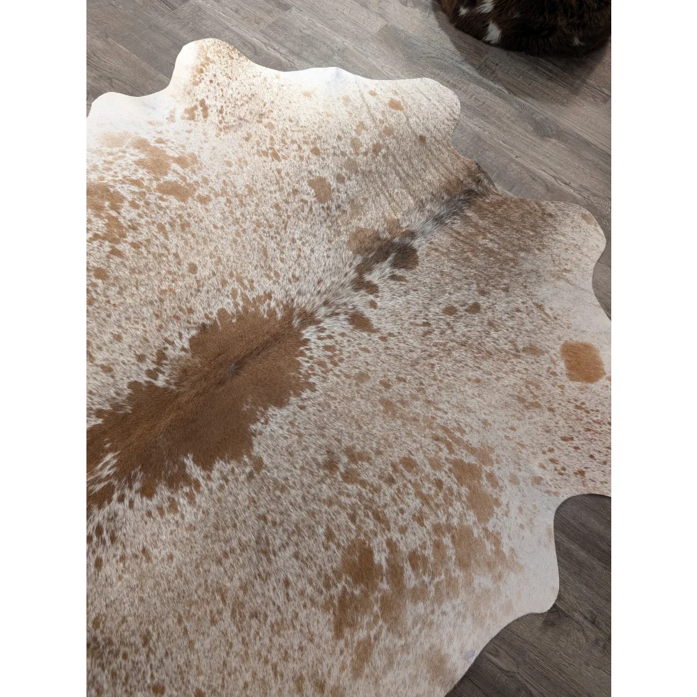 Large cowhide rug t21 72 x 62 inches with white and brown spotted pattern and scalloped edges by angus oliver