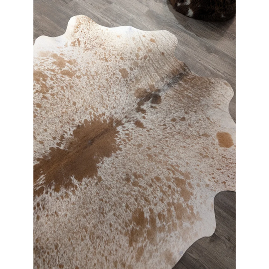 Large cowhide rug t21 72 x 62 inches with white and brown spotted pattern and scalloped edges by angus oliver