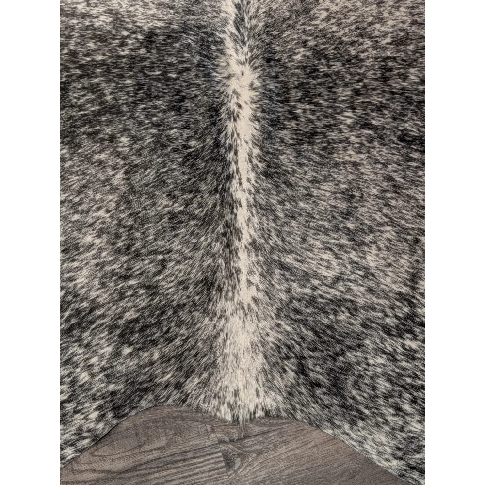 T22 67 x 73 large cowhide rug with black and white speckles and a central cream stripe by angus oliver