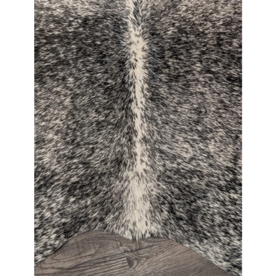 T22 67 x 73 large cowhide rug with black and white speckles and a central cream stripe by angus oliver