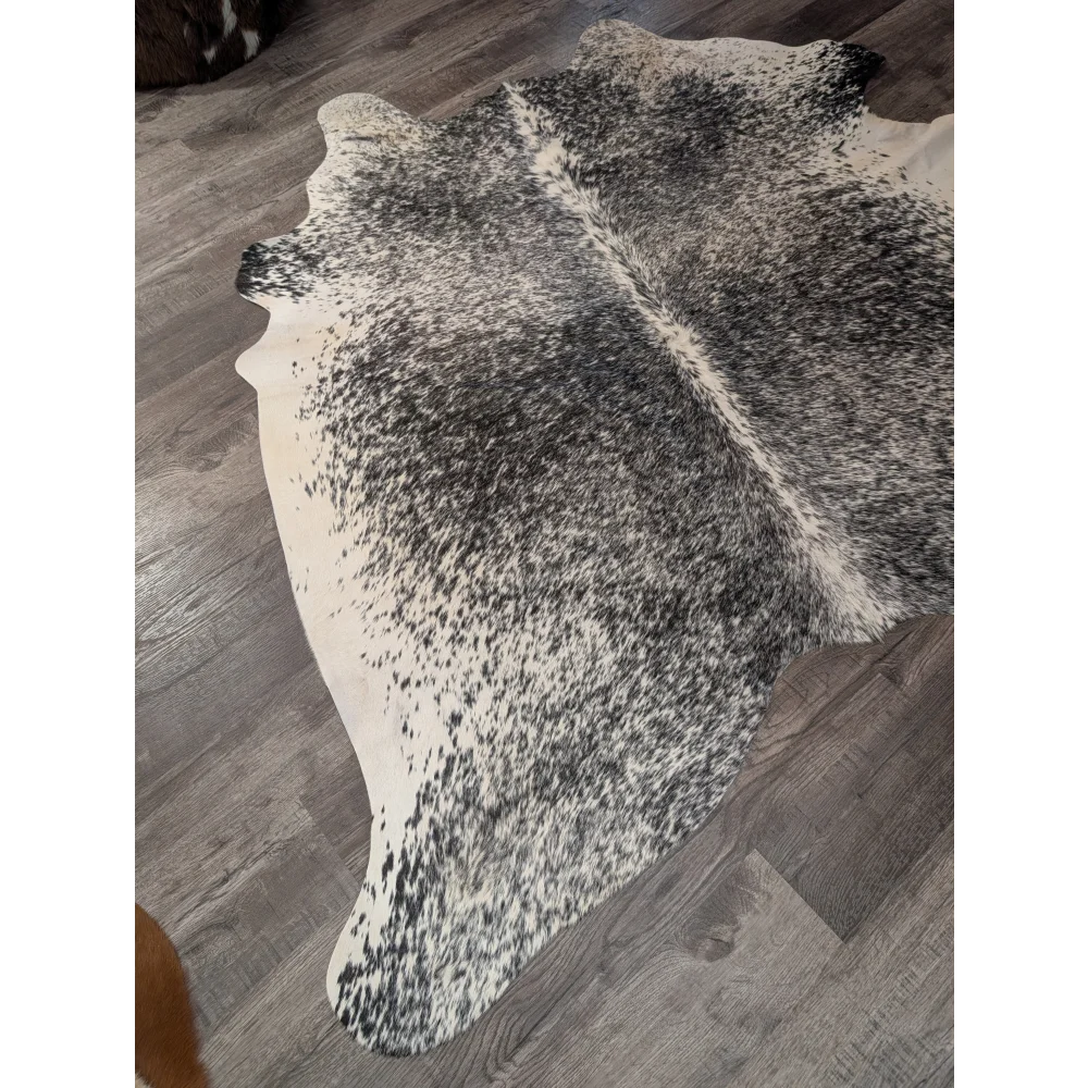 T22 large cowhide rug 67 x 73 angus oliver black and white speckled with natural irregular edge