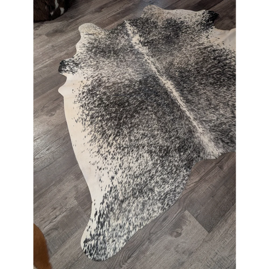 T22 large cowhide rug 67 x 73 angus oliver black and white speckled with natural irregular edge