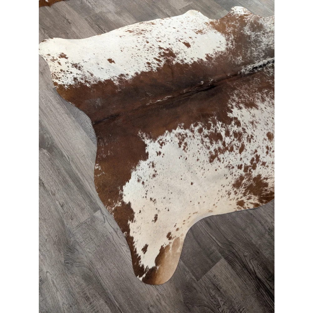 Large cowhide rug angus oliver with brown and white irregular patches perfect for home decor