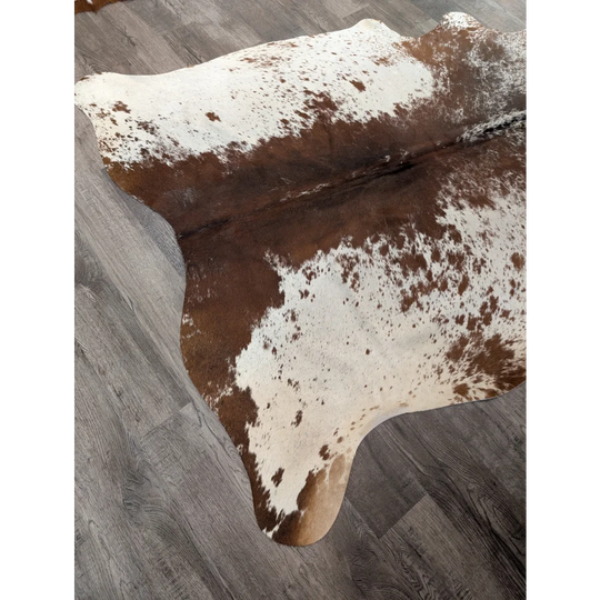 Large cowhide rug angus oliver with brown and white irregular patches perfect for home decor
