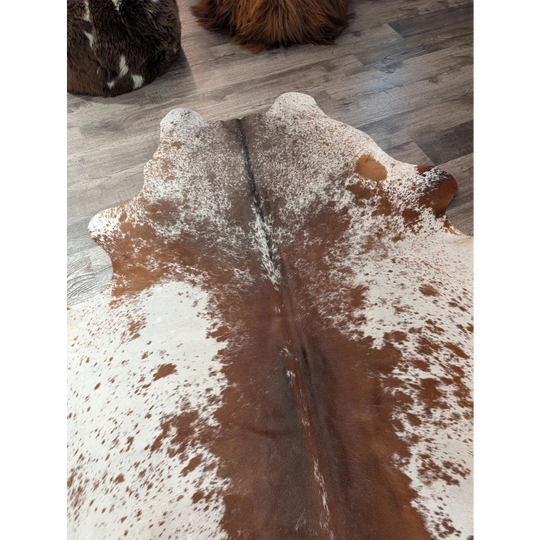 Large cowhide rug t24 featuring brown and white natural patterns perfect for angus oliver style spaces