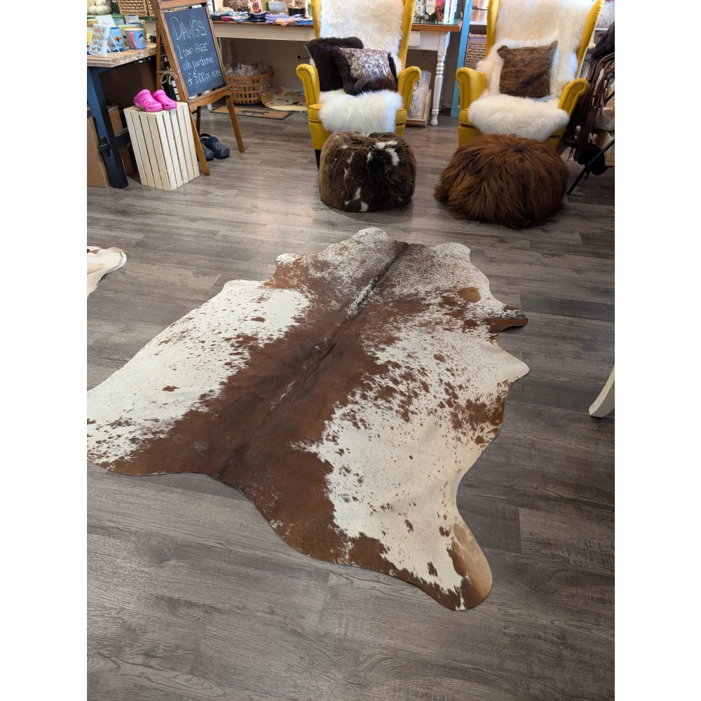 Large brown and white cowhide rug with natural irregular patterns angus oliver t24 77 x 61 gorgeous cowhide
