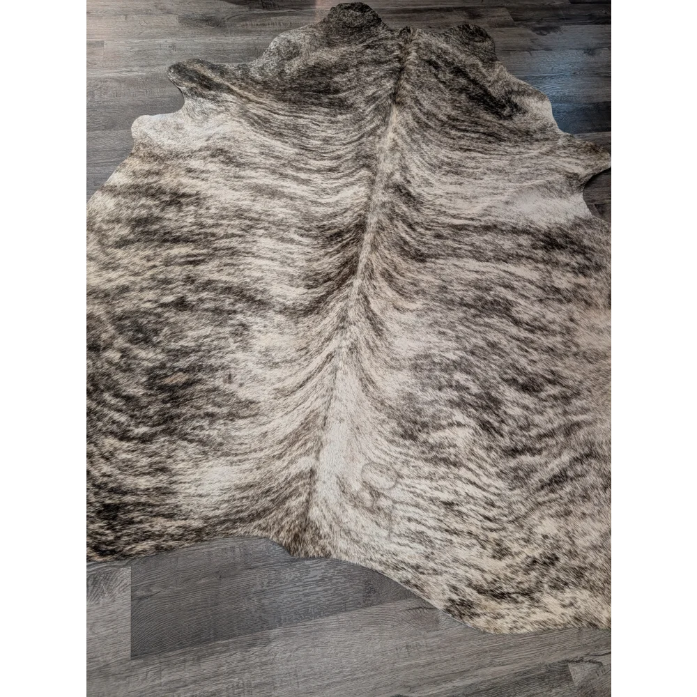 Large cowhide rug t26 angus oliver with irregular dark brown and cream mottled pattern measuring 68 x 63 inches