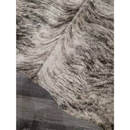 T26 large cowhide rug by angus oliver with plush black and white mottled fur measures 68 by 63 inches