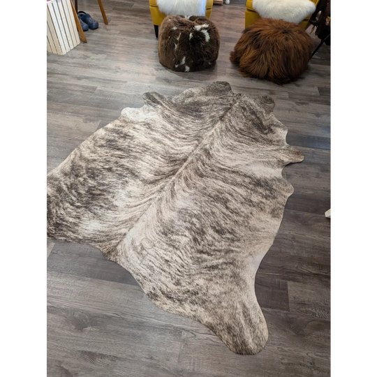 Large cowhide rug angus oliver t26 with irregular brown and white mottled pattern 68 by 63 inches