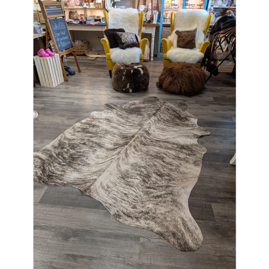 Large cowhide rug T26 by angus oliver features a natural toned mottled brown and beige cowhide perfect for any room