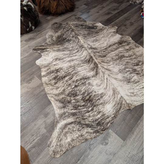 Large cowhide rug t26 with irregular white and dark brown mottled pattern perfect for angus oliver decor