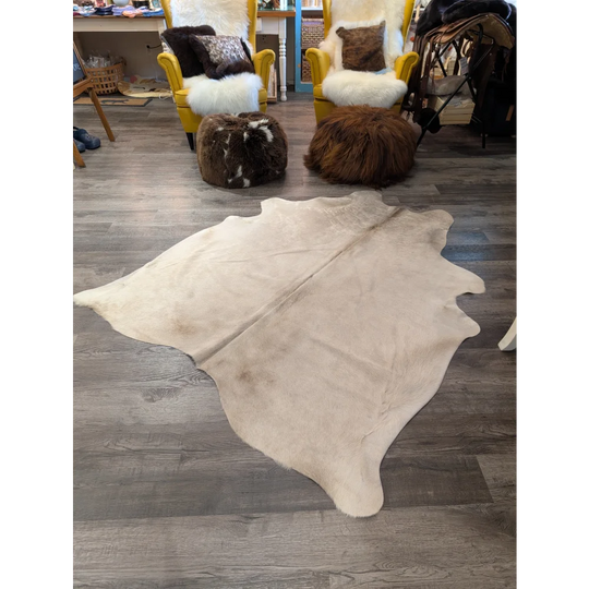Large cowhide rug t29 72 x 61 cream with natural edges and subtle brown markings by angus oliver