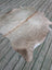 T3 66.5 x 62 large cowhide rug with unique characteristics in natural tones and subtle brownish gray hues