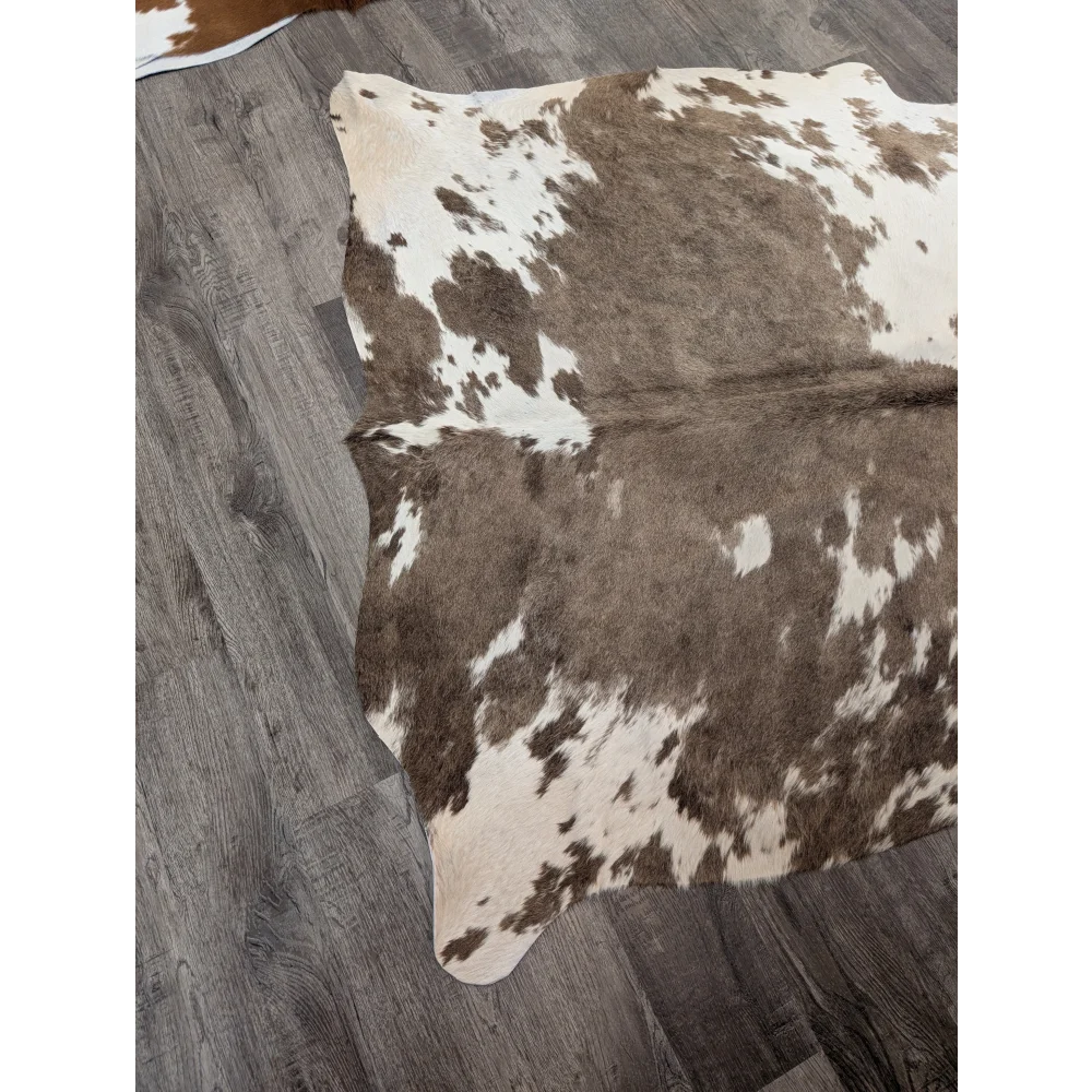 Large brown and white cowhide rug with natural fur texture perfect for stylish living spaces angus oliver t30