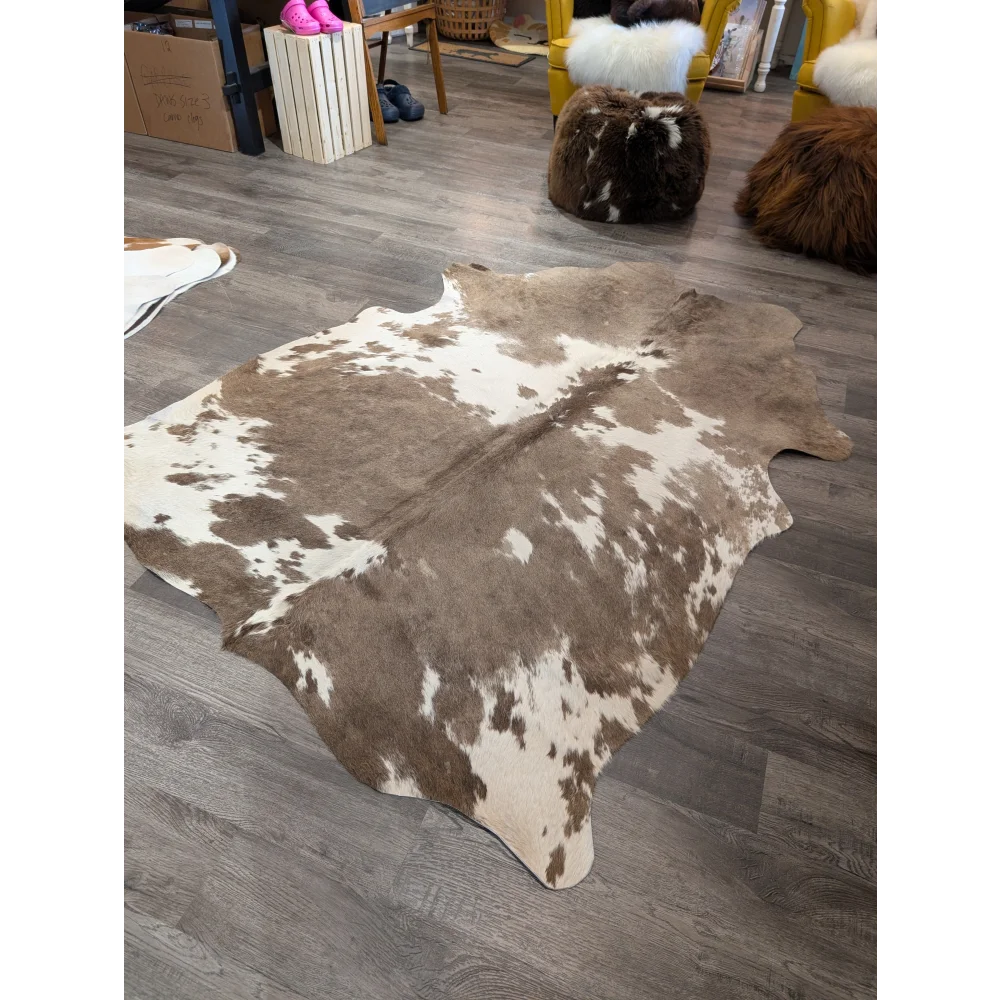 Large cowhide rug t30 74 x 60 with brown and white natural fur texture by angus oliver