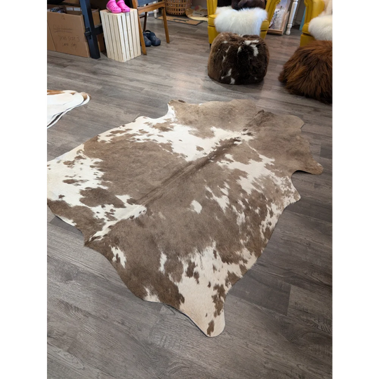 Large cowhide rug t30 74 x 60 with brown and white natural fur texture by angus oliver