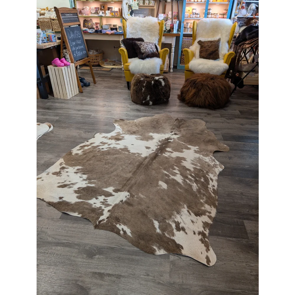 Large brown and white cowhide rug with natural irregular patterns perfect for stylish angus oliver decor