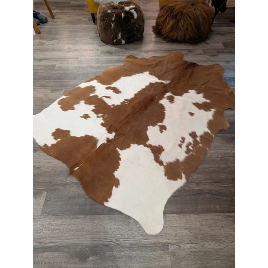 Large brown and white cowhide rug with natural fur texture perfect for stylish home decor angus oliver t31