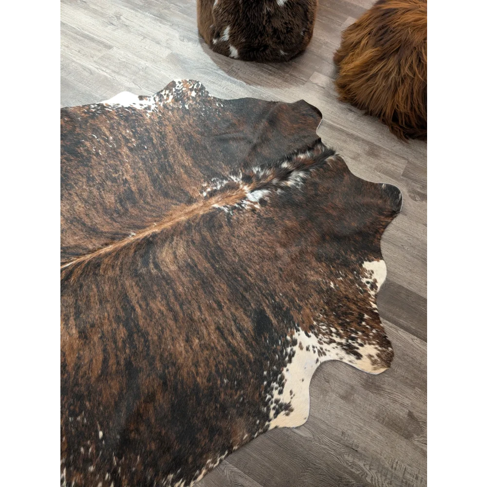 Brown and white large cowhide rug with natural fur texture perfect for stylish home decor angus oliver t32 78 x 59