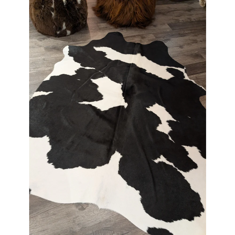 Large cowhide rug t33 73.5 x 64 black and white natural angus oliver cowhide with irregular patches of fur