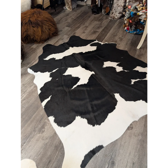 Large cowhide rug T33 73.5 x 64 with black and white natural irregular patches by angus oliver