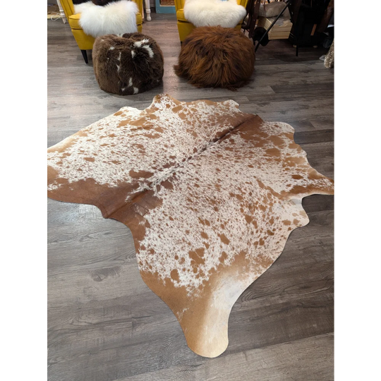 Large cowhide rug angus oliver with brown and white spots and natural irregular edges 67 x 68 inches