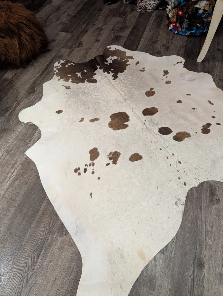 T#37 74 x 67 large cowhide rug with white and brown natural patches by Angus Oliver